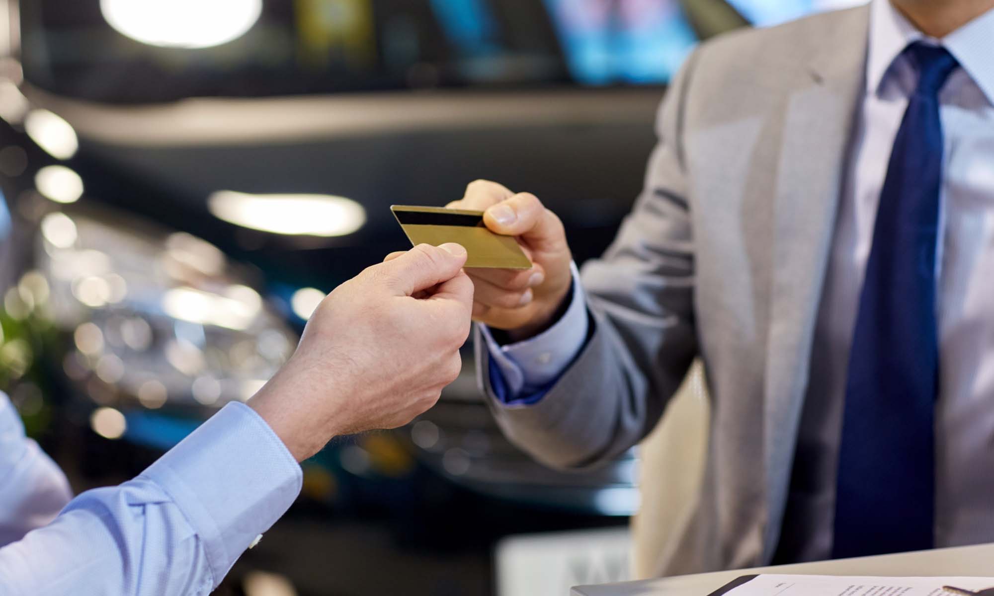 Image-of-a-customer-giving-a-credit-card-to-a-salesman