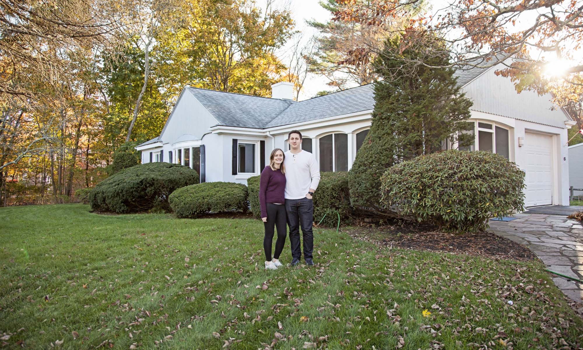 Image-of-a-young-couple-in-front-of-their-first-home