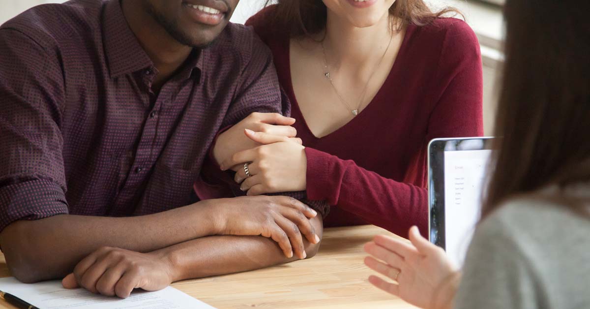 Image-of-a-young-couple-working-with-a-credit-counselor