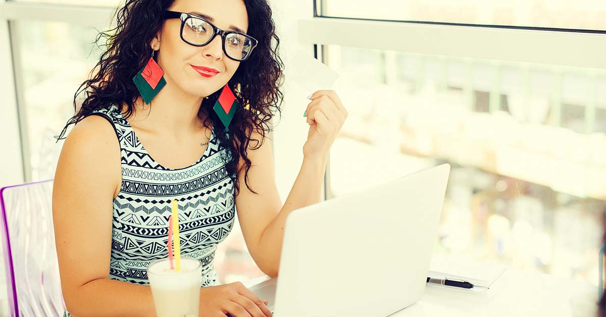 Image-of-a-young-woman-making-a-payment-with-a-credit
