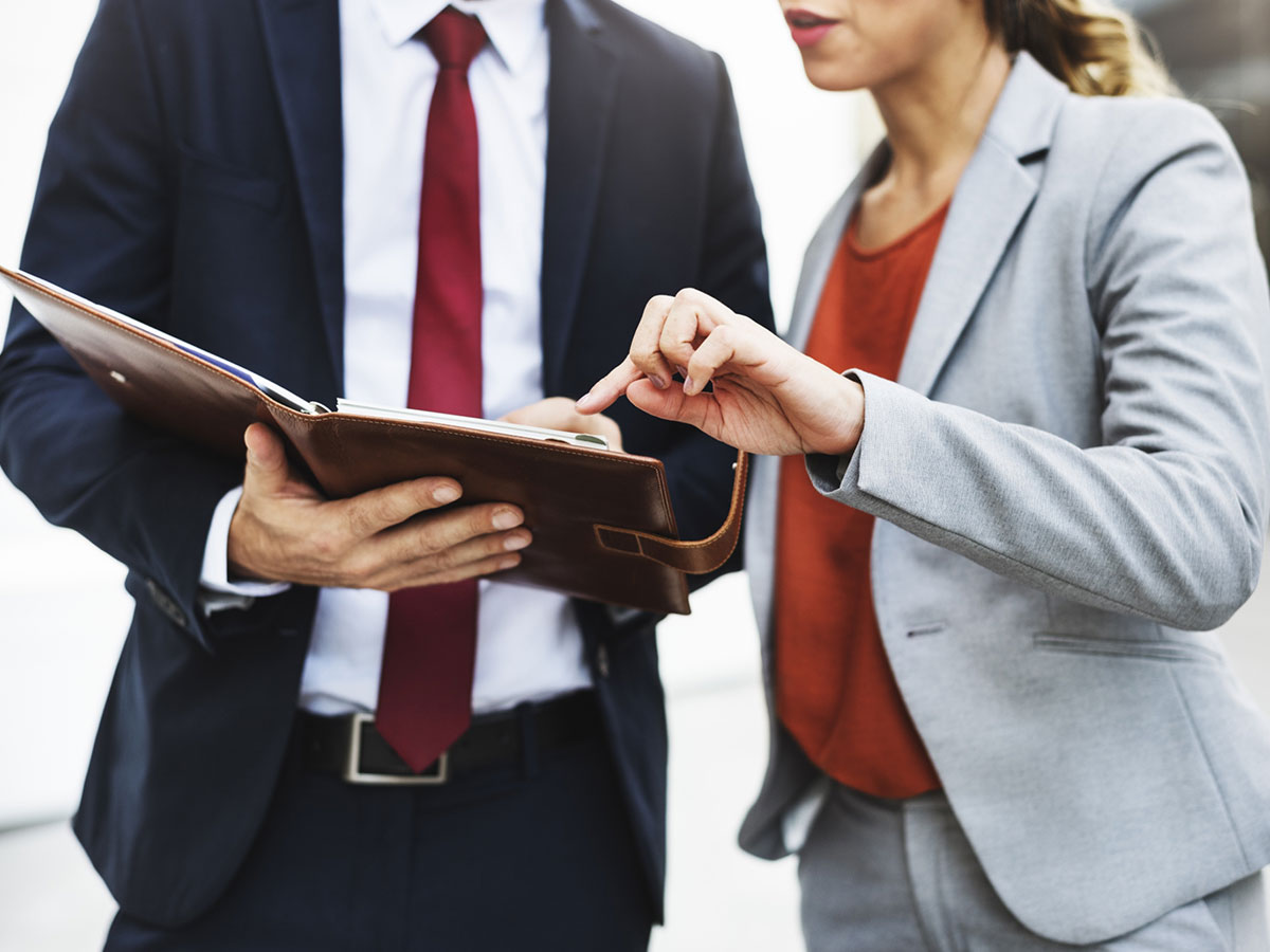 Man and woman reviewing credit scores