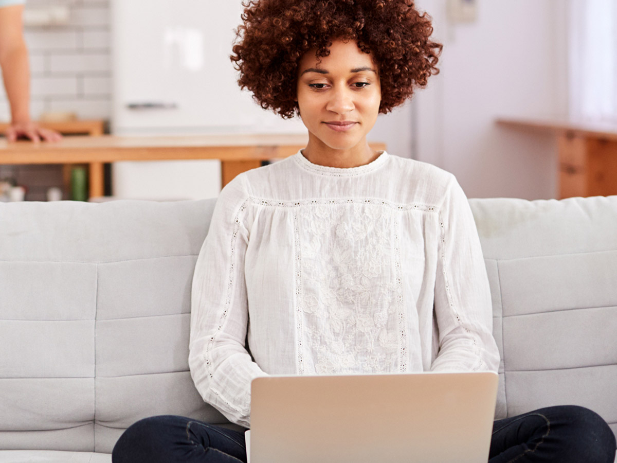 Woman checking her credit score on her laptop