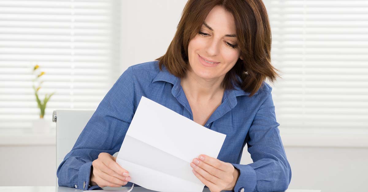 Image-of-a-young-female-looking-at-a-receipt