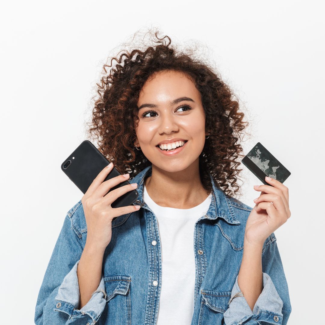 woman holding credit card and wallet