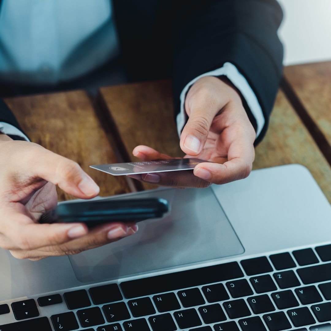 Checking credit card score on phone and laptop