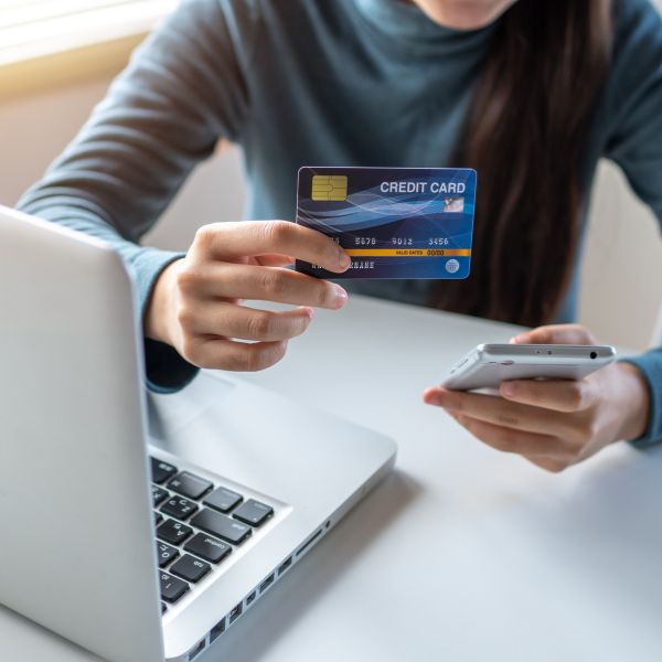 A man inspecting his credit card